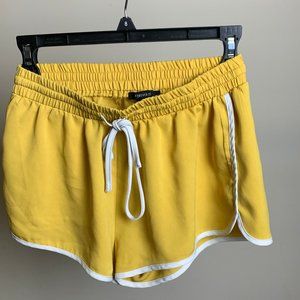yellow shorts with white strips